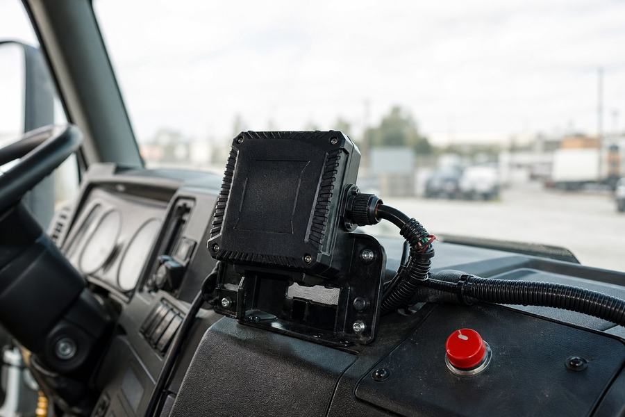 AIS-140 GPS unit mounted in a truck cabin