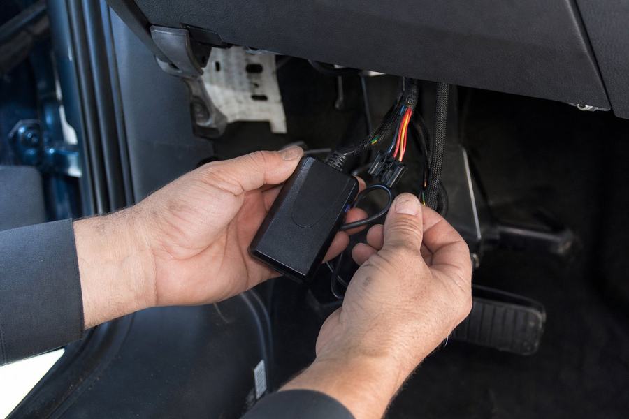 Vehicle GPS tracker installation in a car